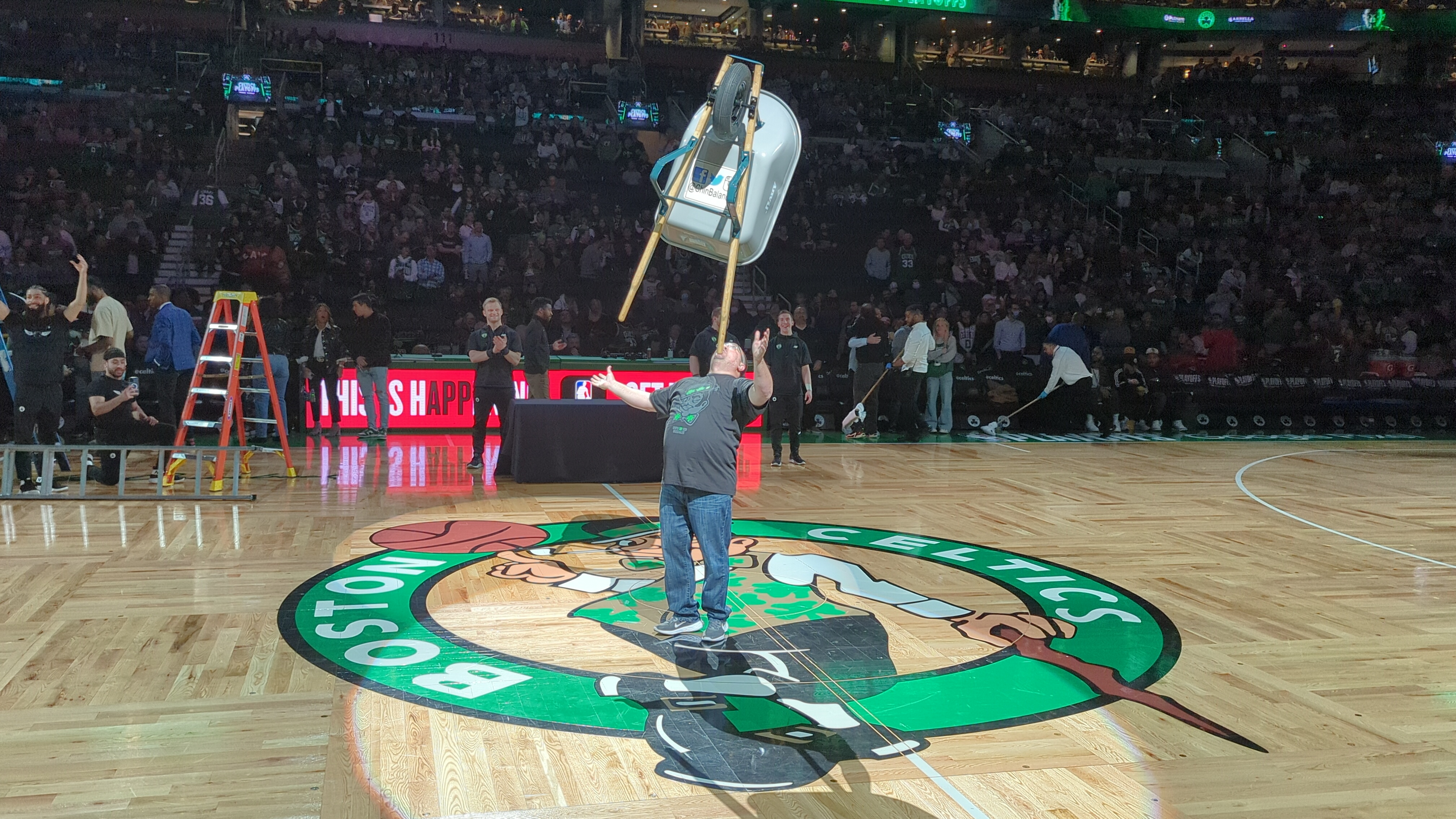 Balancing a chair at Boston Celtics game